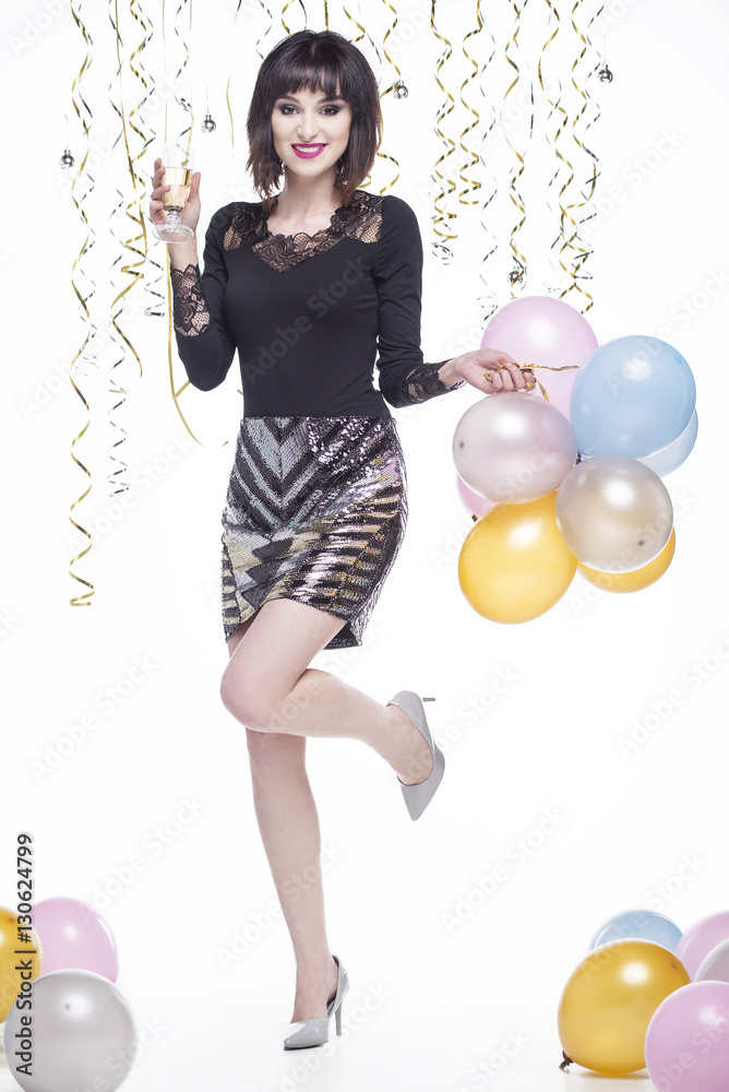 Fototapeta premium Beautiful woman elegantly dressed drinking champagne at the event