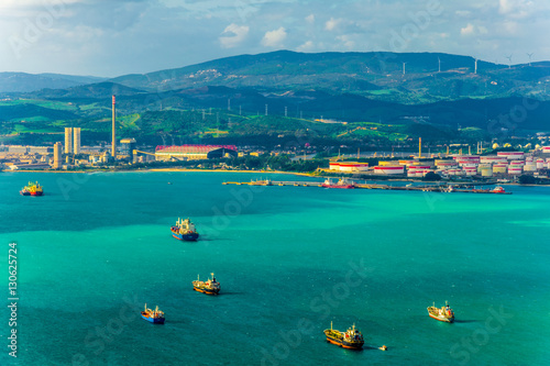 Cargo ships are approaching a port in the algeciras bay in spain.