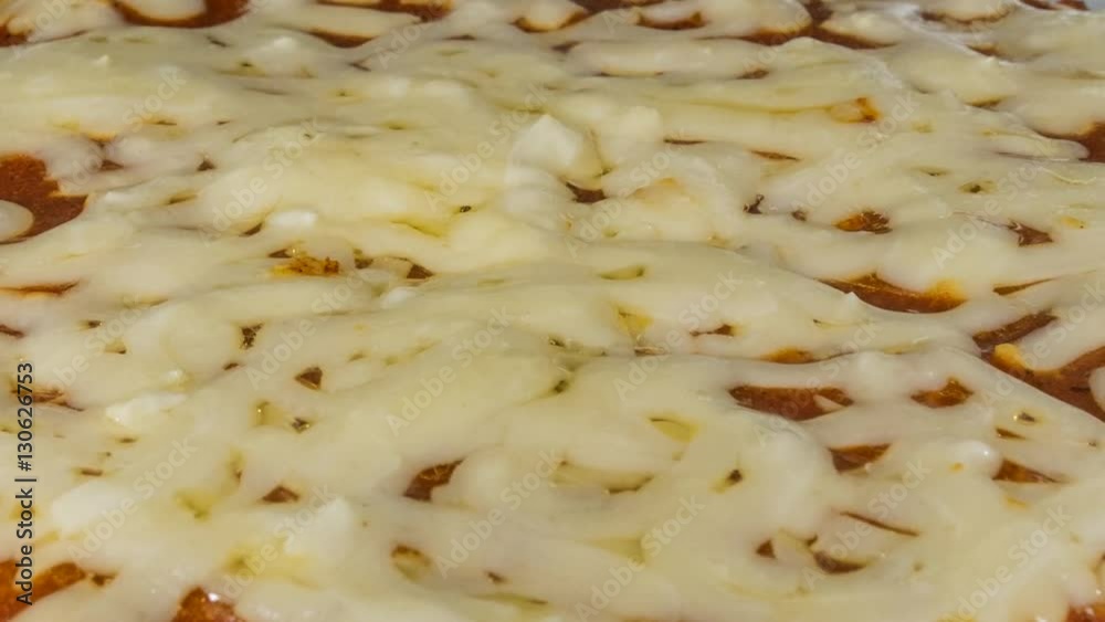 Melting pizza cheese macro close up time lapse.