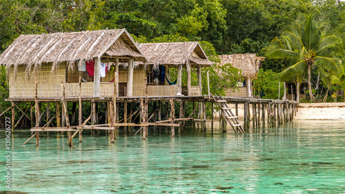 Bamboo Huts on wooden Stocks of an Homestay, Gam Island, West Papuan, Raja Ampat, Indonesia