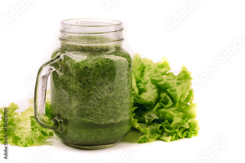 Fresh green smoothie isolated on white background. Superfood, detox and healthy food.