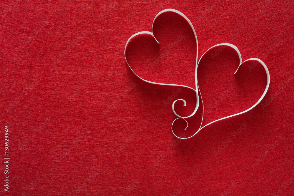 Fototapeta premium Valentine day background, handmade paper hearts on red felt