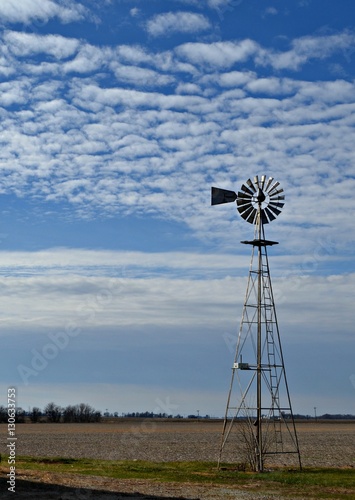 The Windmill on the Farm, Surrounded by Clouds