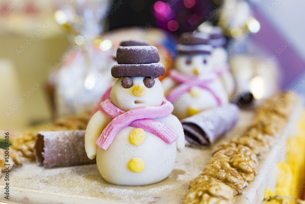 Nougat candy snowman. Christmas background