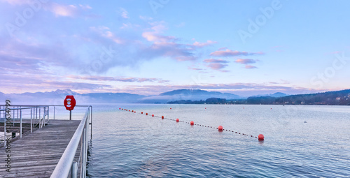 Fototapeta Naklejka Na Ścianę i Meble -  Quiet morning scene with jetty at lake