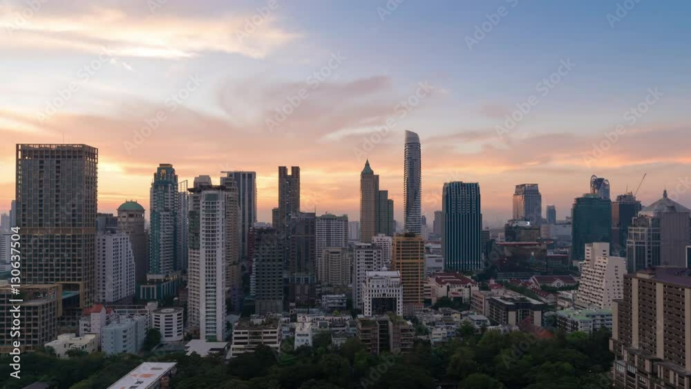 Timelapse day to night cityscape view of modern building in business area town at Bangkok in Thailand Timelapse day to night cityscape view of modern building in business area town at Bangkok in Thailand