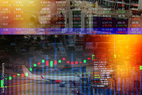 Stock market on display with cityscape and Travel by air transport - Passenger plane is landing from airport background,transportation concept. © namning