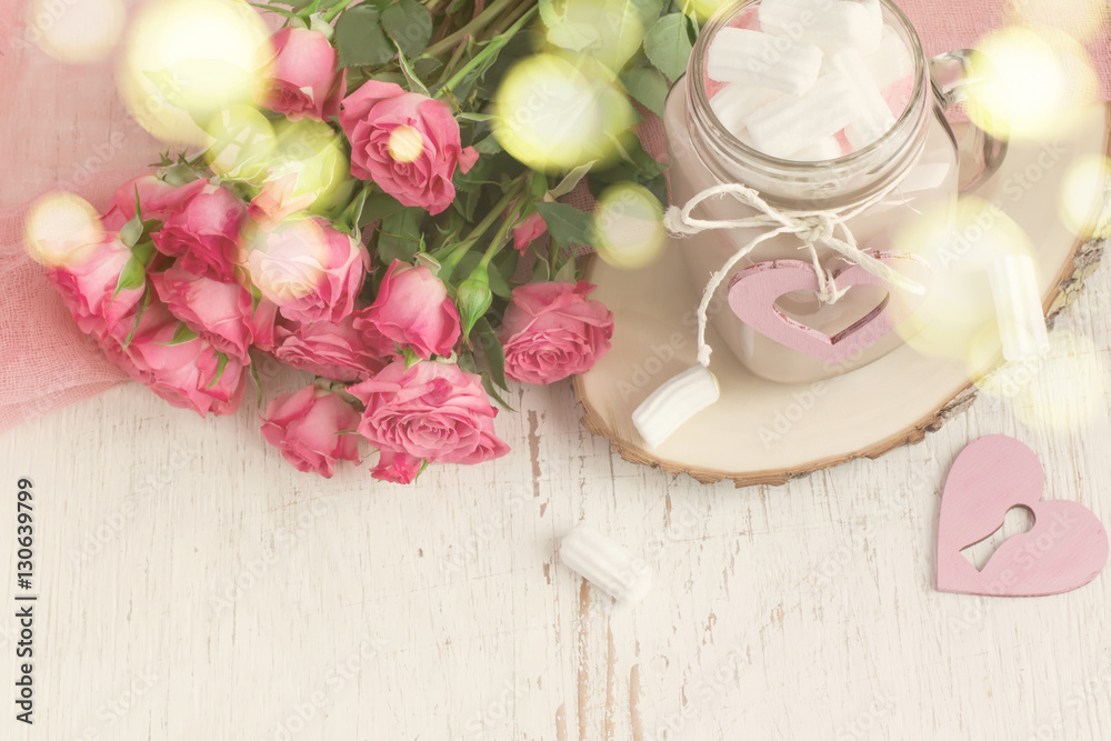 Cocoa with marshmallows and a bouquet of roses. Cocoa with marshmallows and a bouquet of roses.
