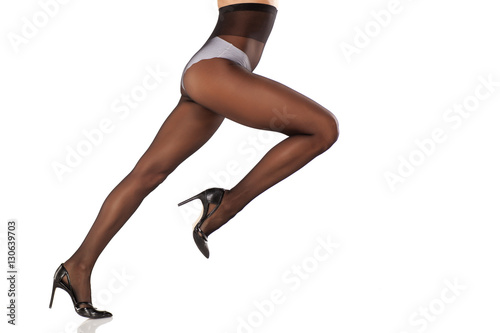 pretty, nice cared feminine legs in nylon stockings high heels