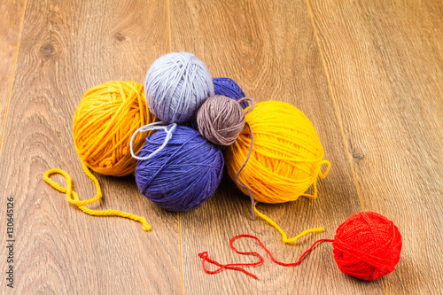 yellow, dark blue, lilac, brown and red yarn