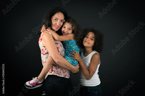 Beautiful family doing different expressions in different sets of clothes: love