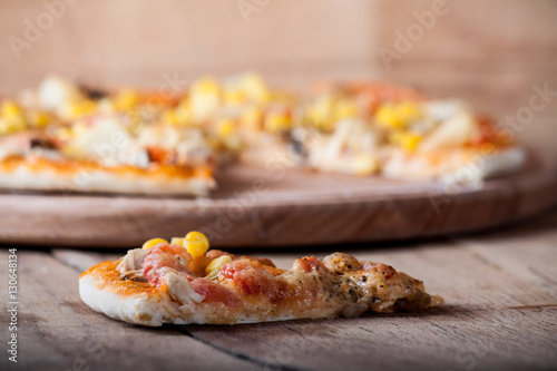 Fresh pizza isolated on wood desk