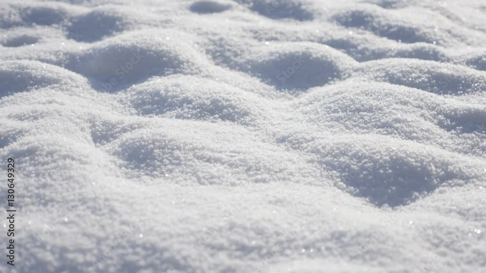 Sparkling white snow dunes on the early morning close-up 4K 3840X2160 UHD tilting video - Frozen crystalline water snowflakes over the hill 2160p UltraHD slow tilt footage Sparkling white snow dunes on the early morning close-up 4K 3840X2160 UHD tilting video - Frozen crystalline water snowflakes over the hill 2160p UltraHD slow tilt footage