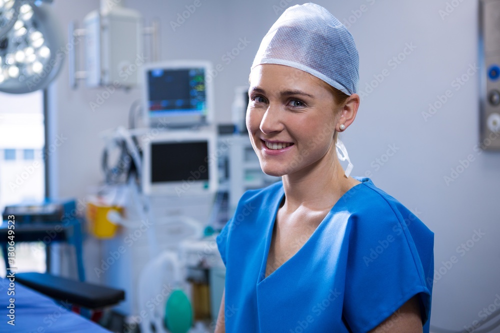 Portrait of female nurse smiling in operation theater Portrait of female nurse smiling in operation theater
