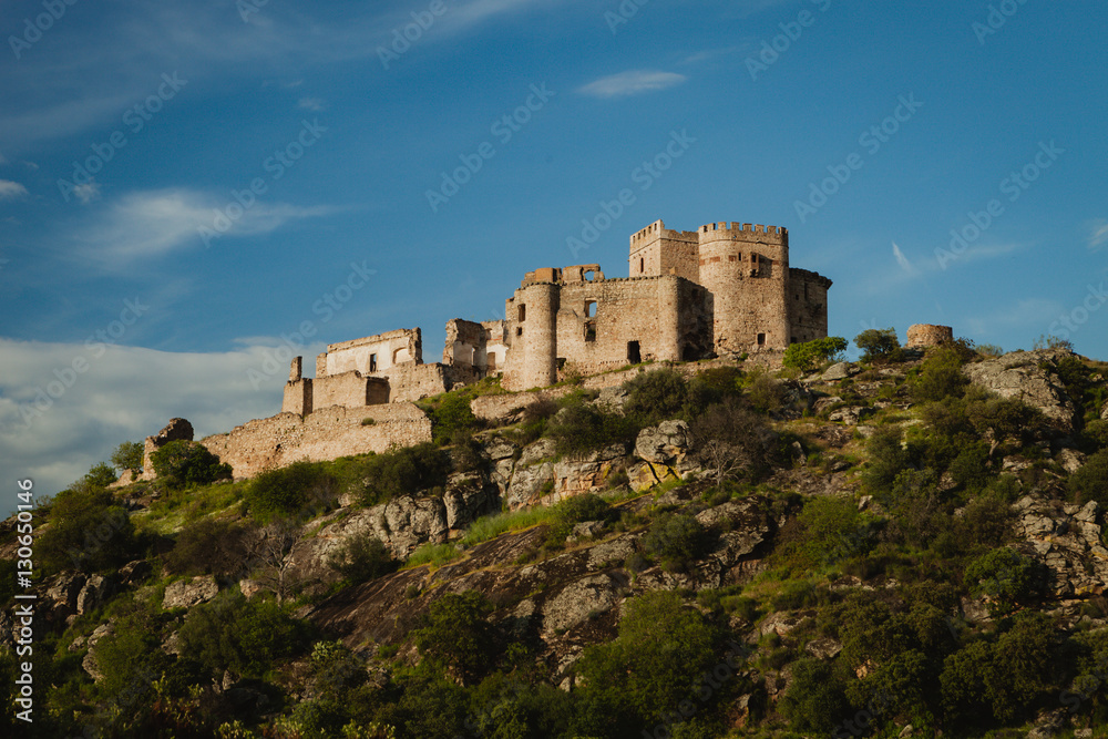 Beautiful Spanish old castle over a hill and a beautiful sky