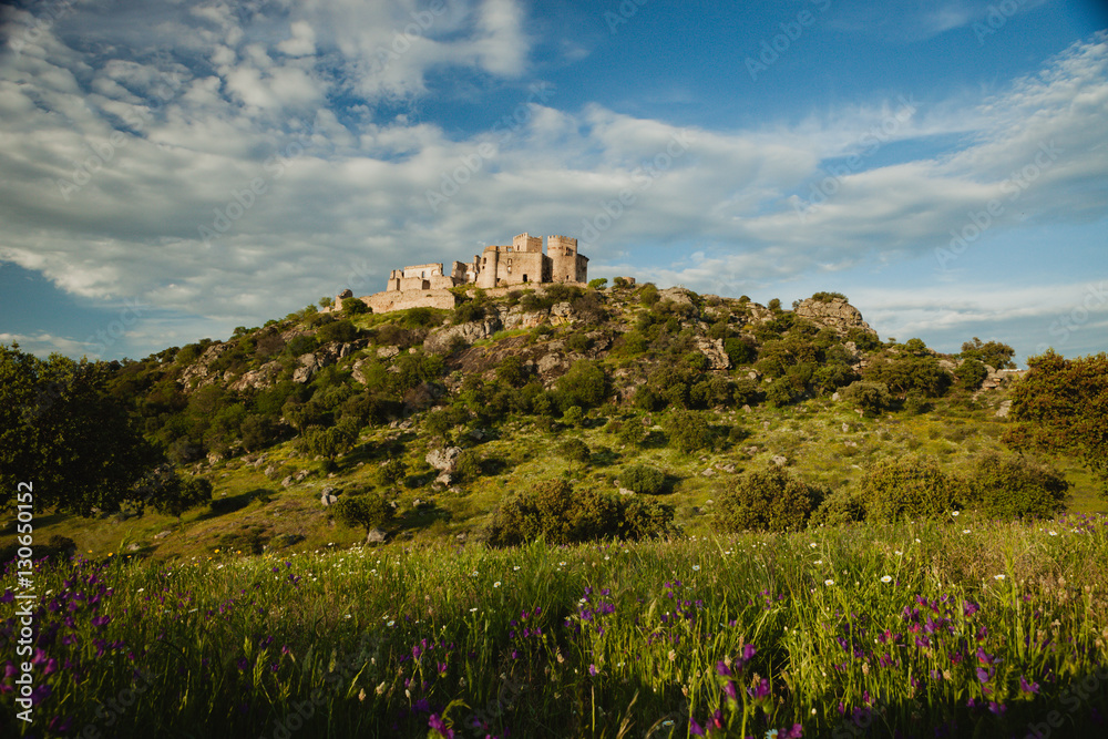 Beautiful Spanish old castle over a hill and a beautiful sky