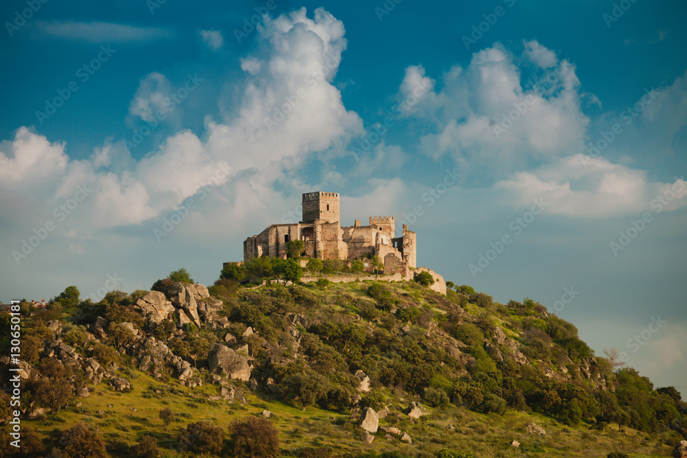 Beautiful Spanish old castle over a hill and a beautiful sky