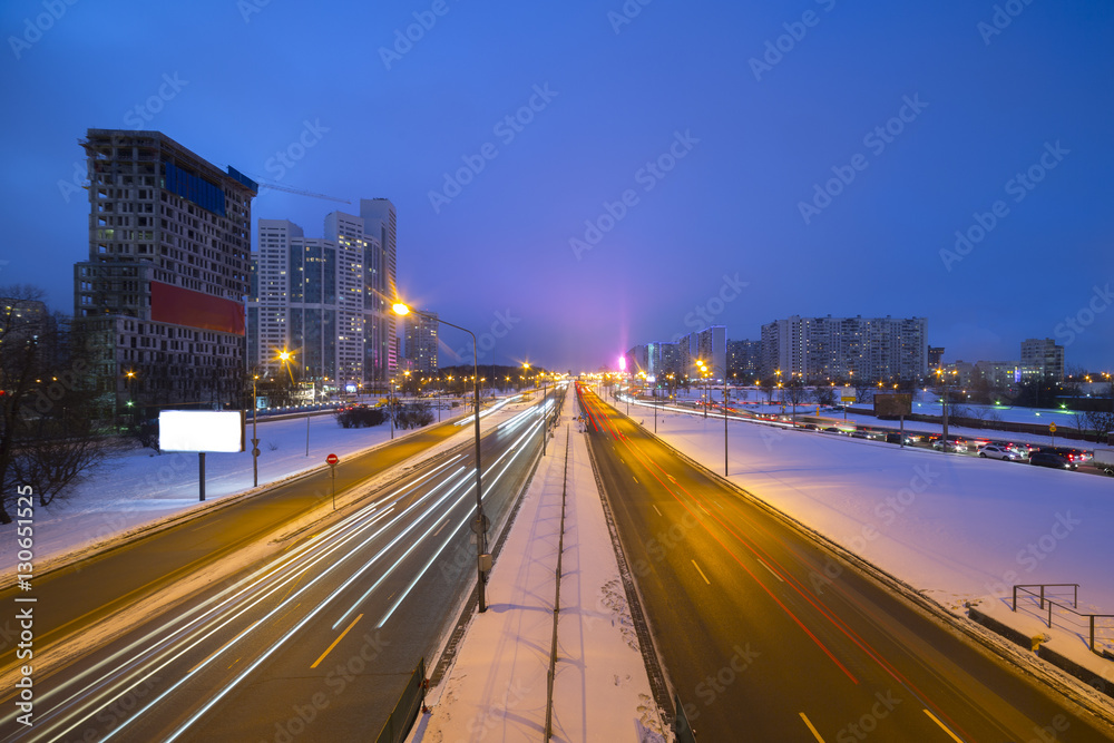 Night road in the city with car the light trails