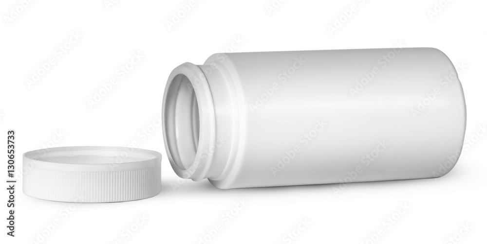 White plastic bottle for vitamins lying near lid White plastic bottle for vitamins lying near lid