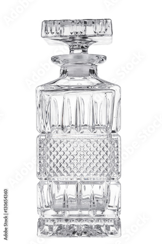 Empty crystal decanter on white background photo
