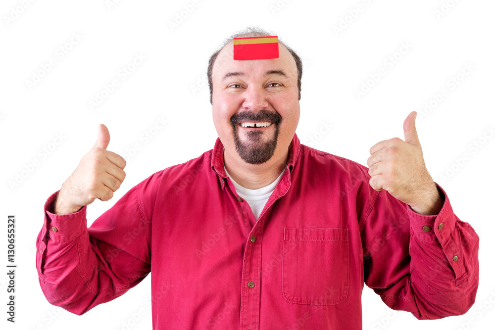 Man with thumbs up and credit card on forehead