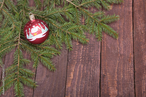 Christmas decoration tree with ball on wooden background photo