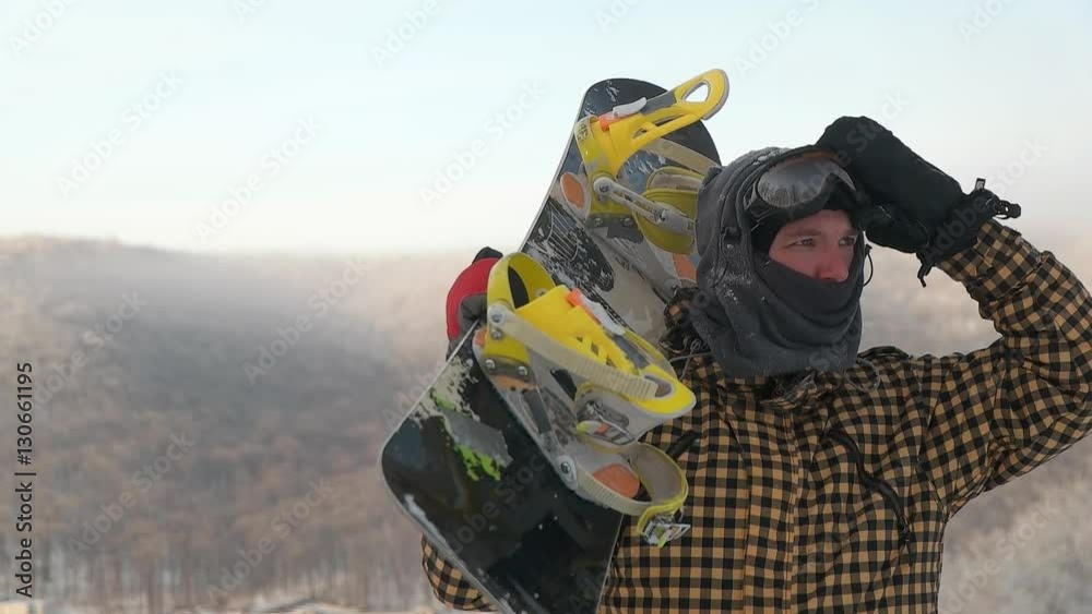 Snowboarder on top of the mountain Snowboarder on top of the mountain
