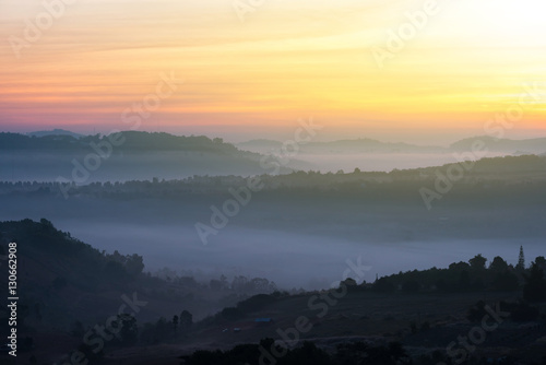 Beautiful green hills glowing warm sunrise,Dramatic shine silhou © iStocker