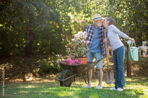 Senior couple kissing in the garden