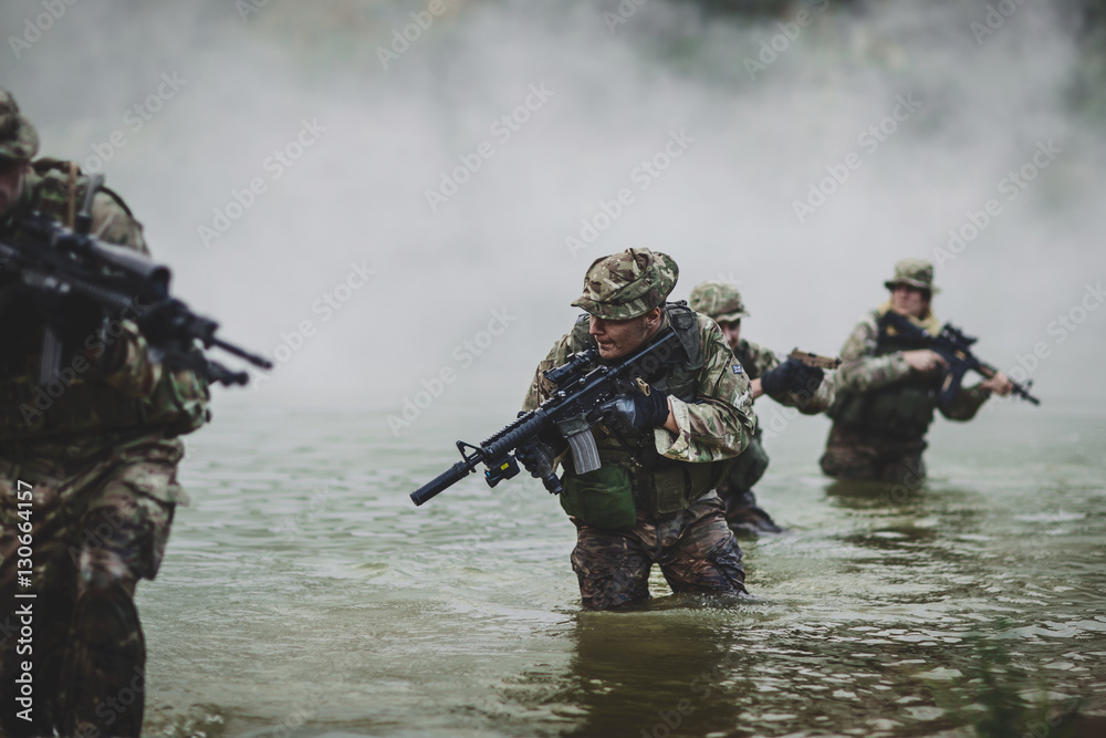 Fototapeta premium special forces soldiers with weapon take part in military maneuv