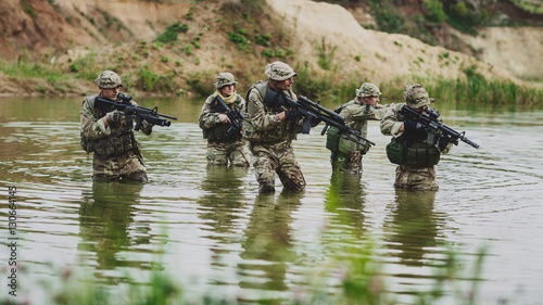 special forces soldiers with weapon take part in military maneuv