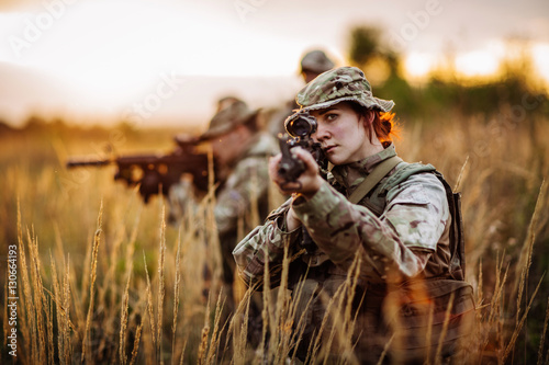Rangers shooting with his weapon, rifle at sunset. War, army