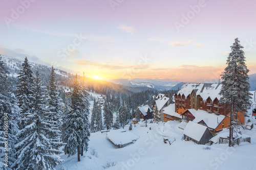 Winter resort with slopes for skiing and snowboarding photo