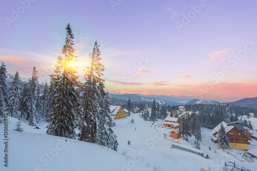 Winter resort with slopes for skiing and snowboarding photo