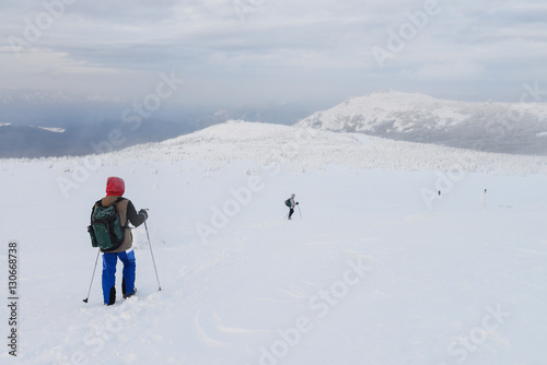 Group of hikers in winter mountains, Russia, Ural.