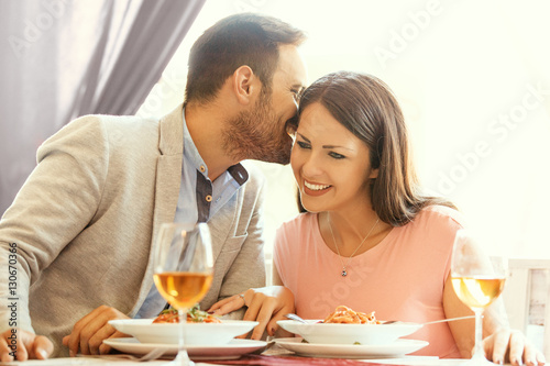 Haooy Couple Enjoying Spaghetti in a Reastaurant photo