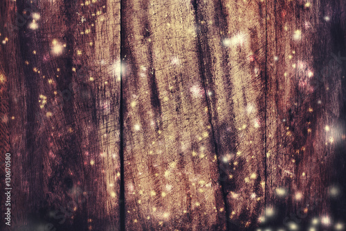 Christmas wooden background with falling snow. View with copy sp