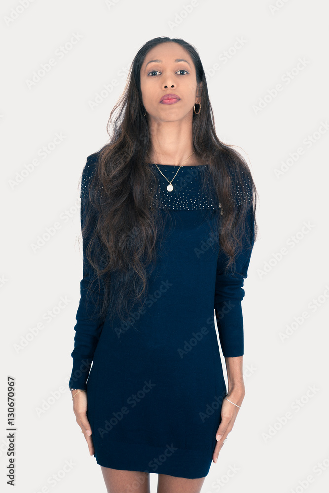 Beautiful woman doing different expressions in different sets of clothes: at attention Beautiful woman doing different expressions in different sets of clothes: at attention
