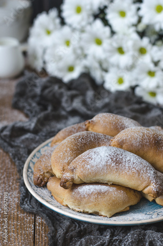 Croissants with cheese cup of tea and chrysanthemums for breakfa photo