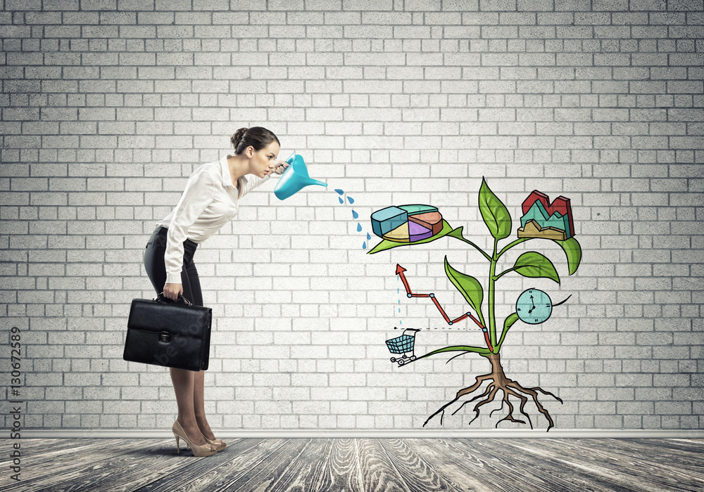 Young businesswoman in empty room watering drawn growth concept with can Young businesswoman in empty room watering drawn growth concept with can