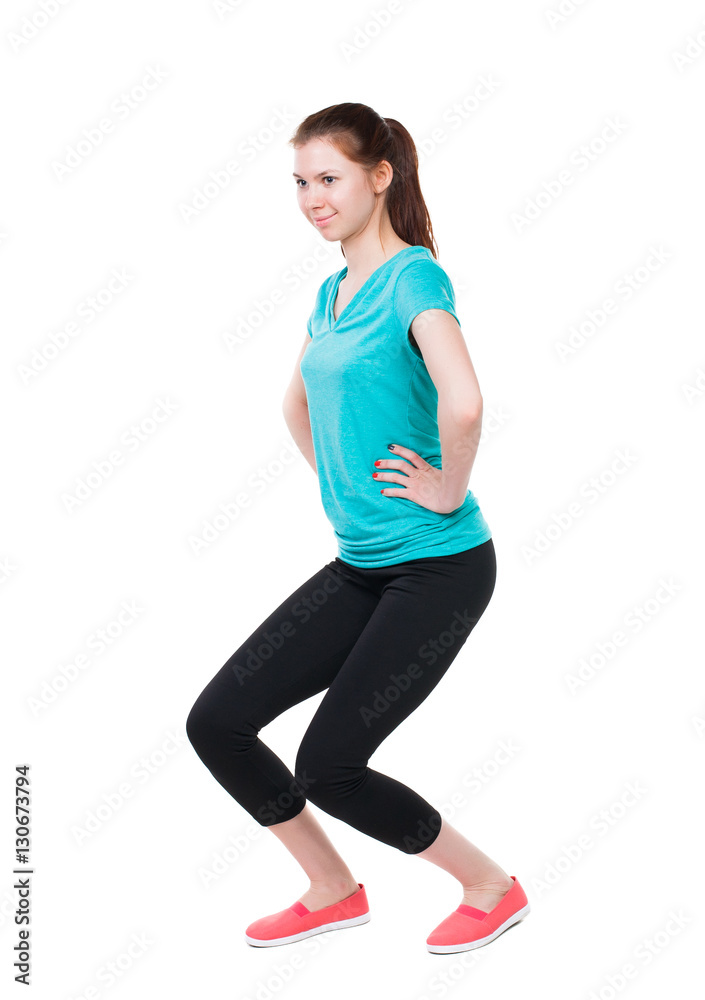 back view of standing young beautiful woman in sport dress involved in Pilates. Rear view people collection. backside view of person. Isolated over white background. Sport girl in black tights in back view of standing young beautiful woman in sport dress involved in Pilates. Rear view people collection. backside view of person. Isolated over white background. Sport girl in black tights in
