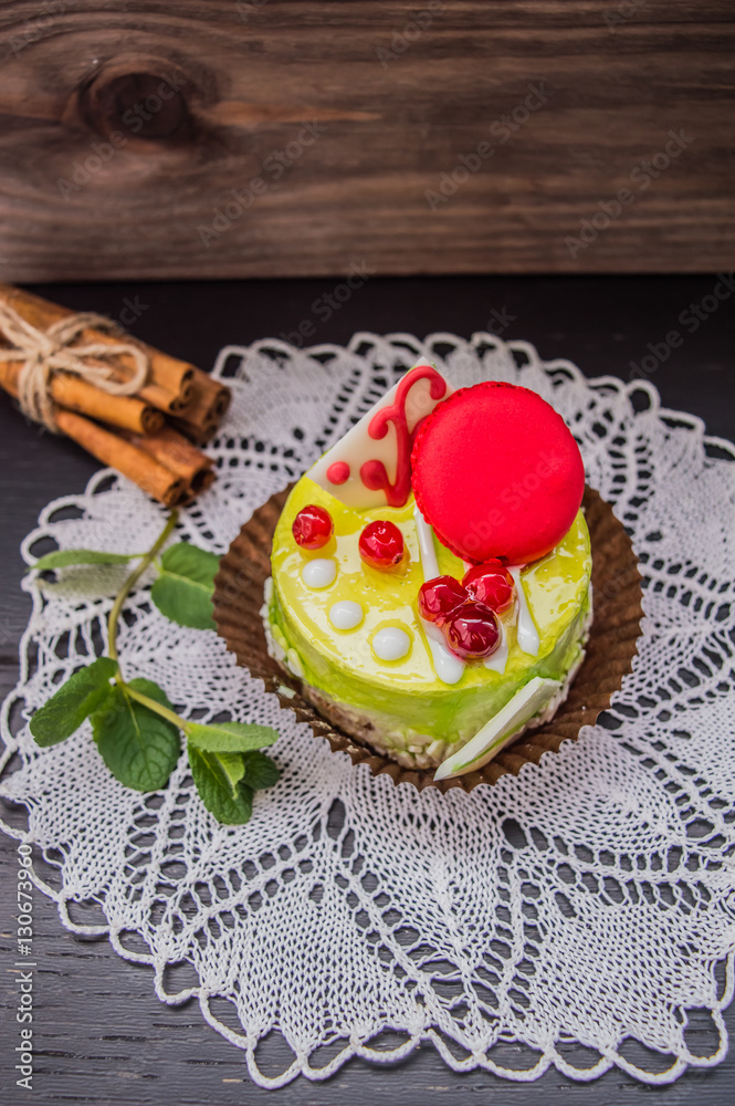 Cake with cream on a dark wood background. Top view. Close-up Cake with cream on a dark wood background. Top view. Close-up