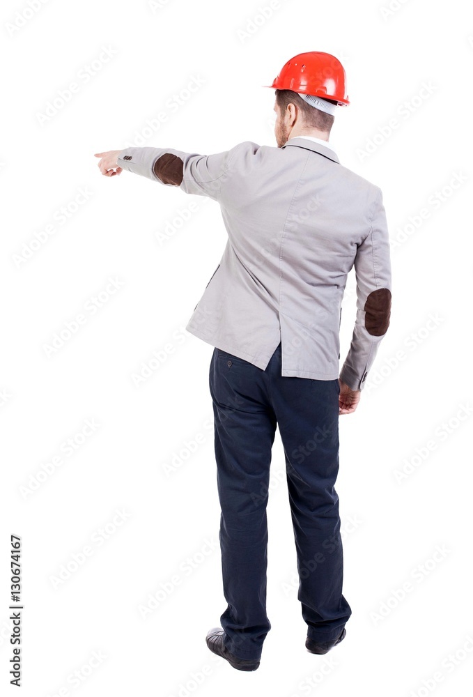 Back view of pointing young men in helmet. Back view of pointing young men in helmet.