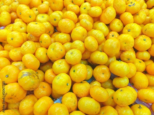Top view of orange fruits background at market