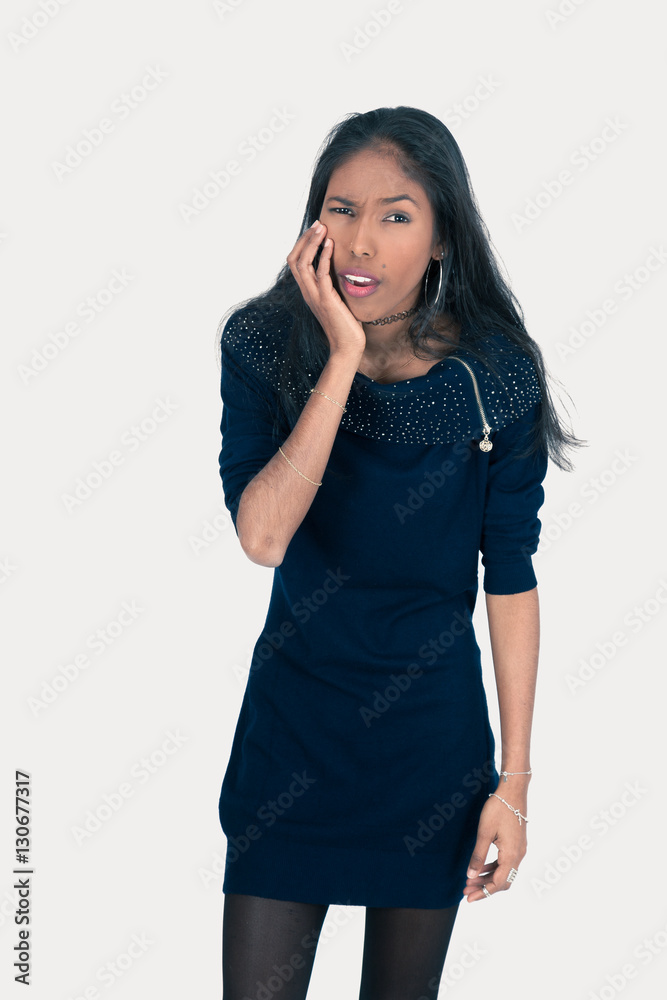 Beautiful woman doing different expressions in different sets of clothes: toothache Beautiful woman doing different expressions in different sets of clothes: toothache