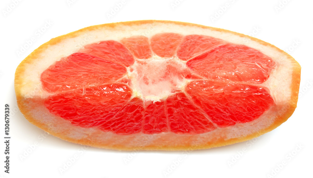Slice of grapefruit close-up isolated on white background