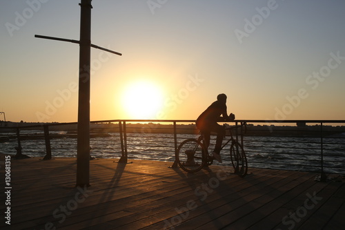 Man on bike in the evening Tel Aviv