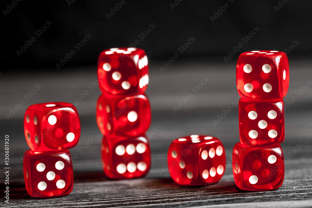 concept luck - dice gambling on dark wooden background concept luck - dice gambling on dark wooden background