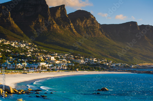 Camps Bay beach with the view of the Twelve Apostles mountain range. Cape Town. South Africa photo
