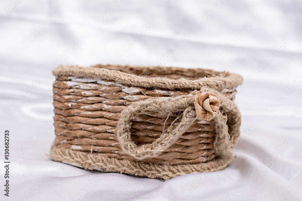 Woven basket for wedding birthday flower arrangement on white sa